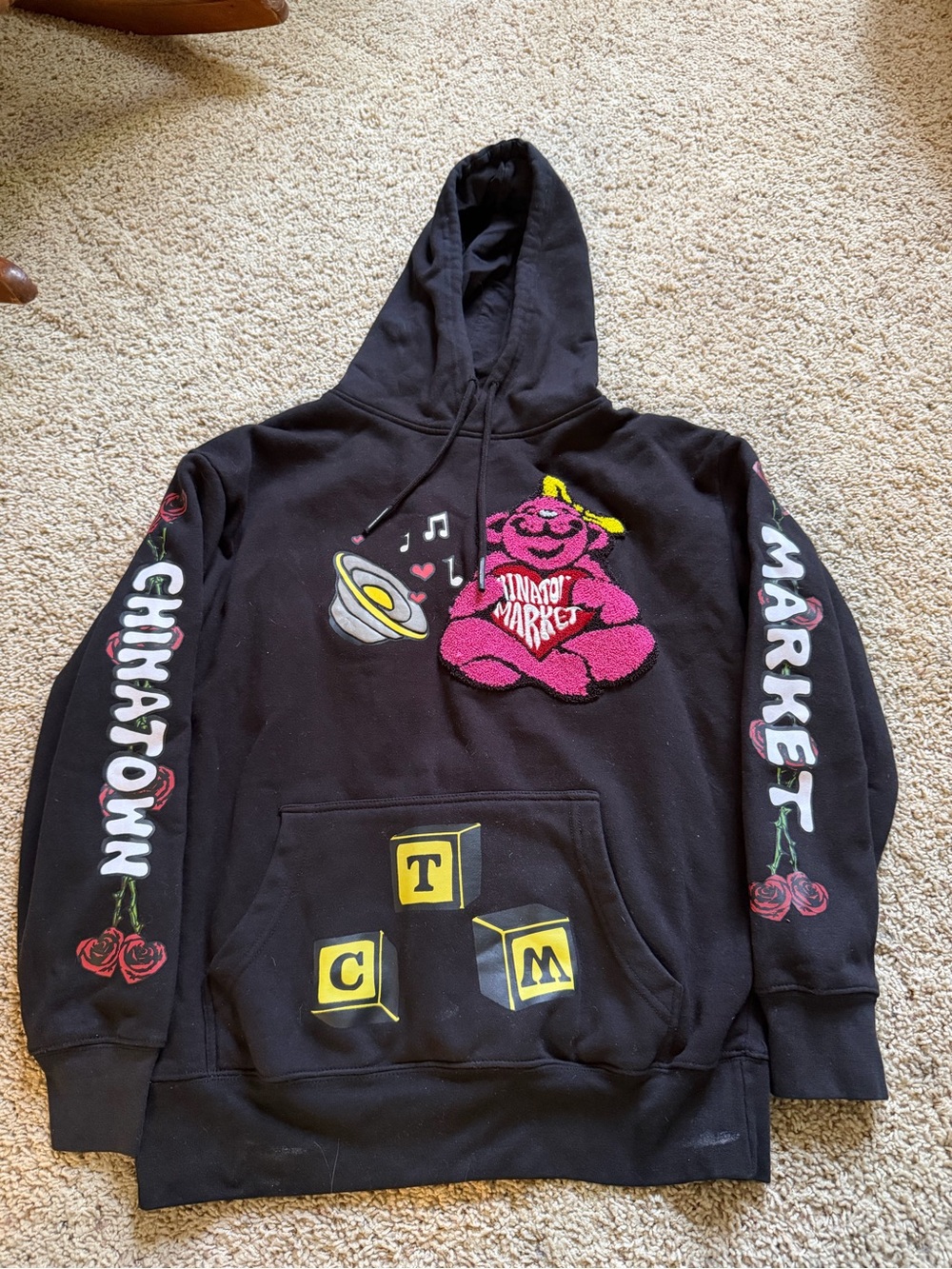 Chinatown Market Black Hoodie with Pink Bear Accent
